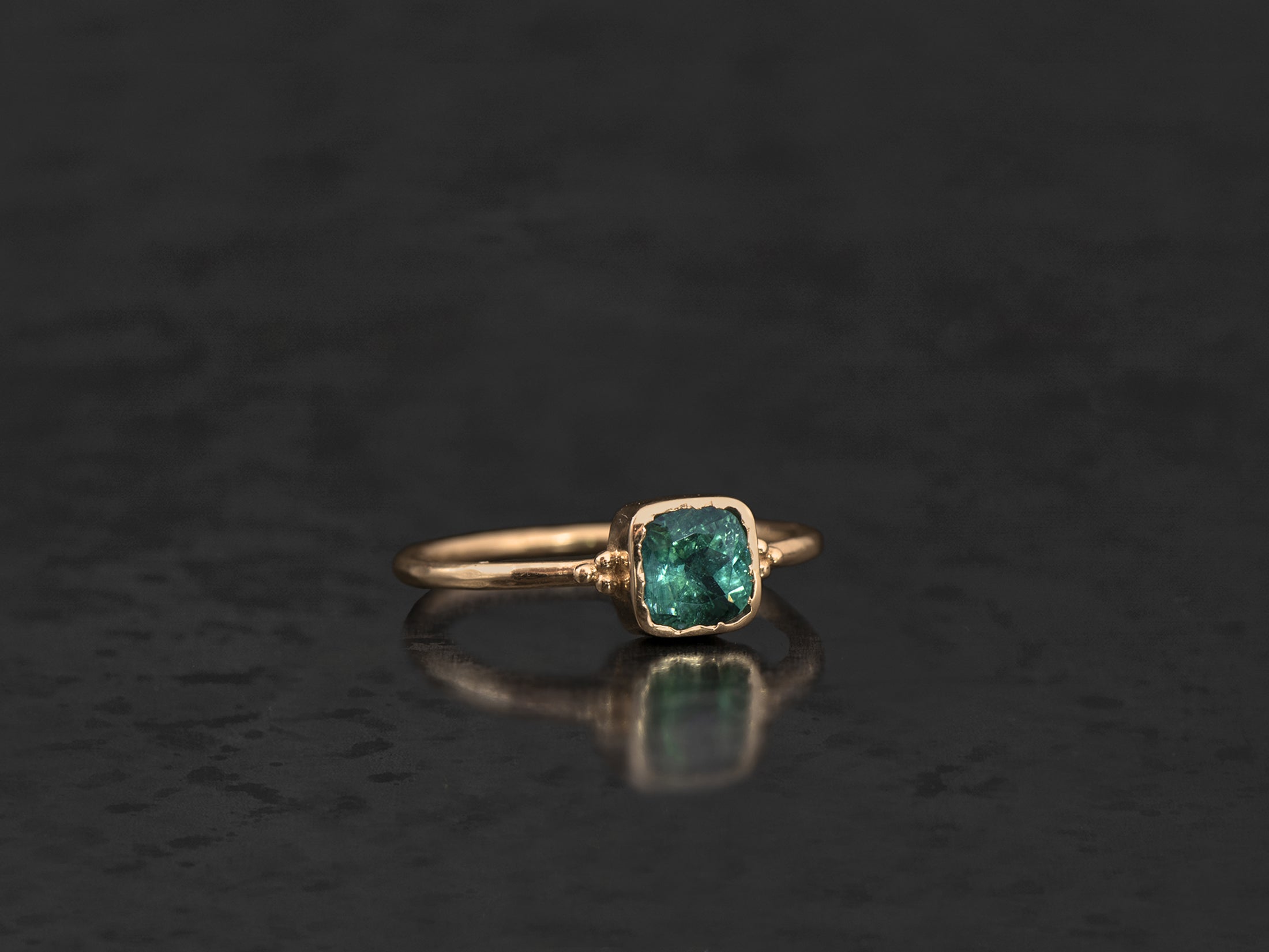 Yellow gold Zelda ring with 0.70cts cushion blue tourmaline